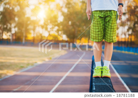 Legs of a gymnast on the balance beam apparatus 18781188