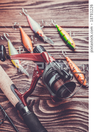 fishing tackle on a wooden table 18781226