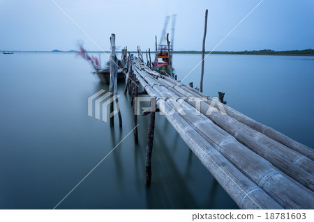 Bamboo bridge and moving fishing boat  18781603