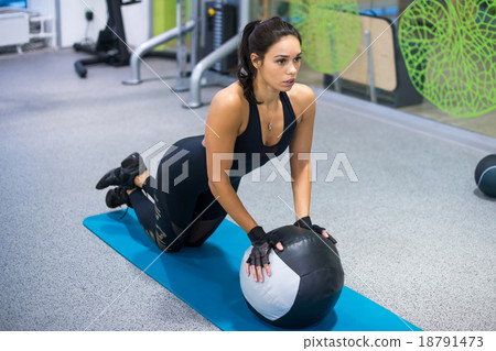 Fit woman exercising with medicine ball workout 18791473