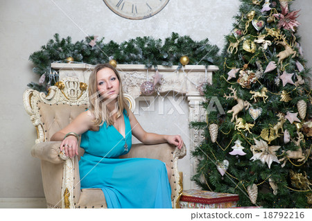 Young woman at Christmas tree. New Year content Young woman at Christmas tree. New Year content 18792216