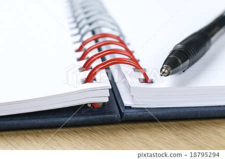 pen and blank opened notebook 18795294