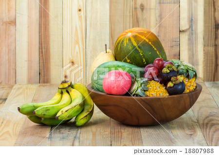 Different fruits on old wooden background 18807988
