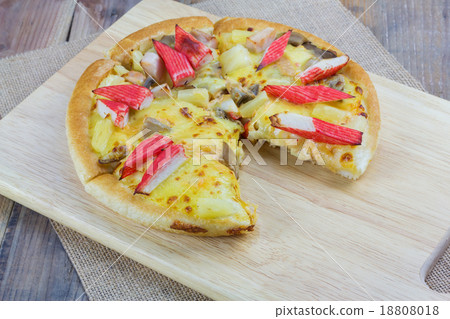 Homemade pizza on wooden table 18808018
