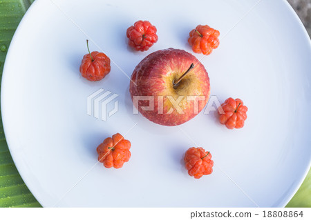 Cayenne cherry and apple on banana leaves Cayenne cherry and apple on banana leaves 18808864