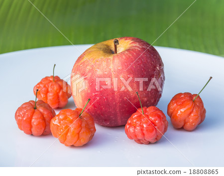 Cayenne cherry and apple on banana leaves 18808865