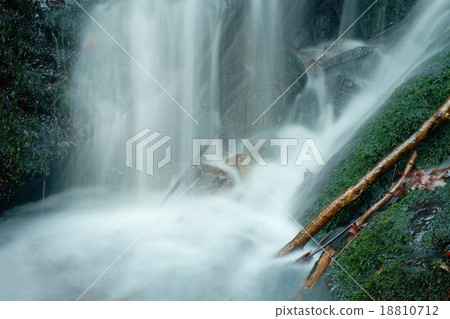 Small waterfall on mountain stream, clear water  18810712