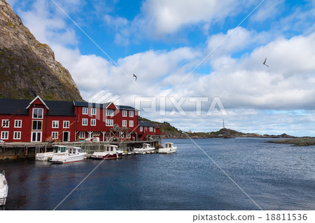 Typical red rorbu fishing hut in town of A village Typical red rorbu fishing hut in town of A village 18811536
