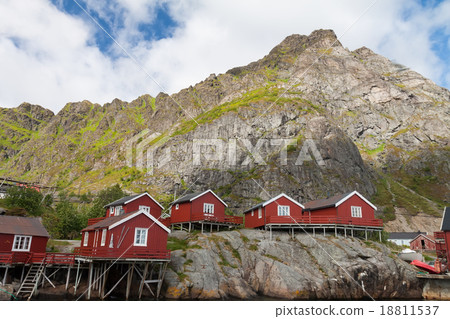 Typical red rorbu fishing hut in town of A village Typical red rorbu fishing hut in town of A village 18811537