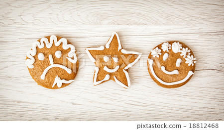 Three tasty gingerbread smiley faces, Christmas symbol Three tasty gingerbread smiley faces, Christmas symbol 18812468