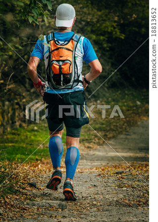 young man runs through Park young man runs through Park 18813652