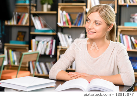 Young woman in the library. 18813877
