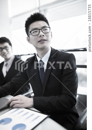 Business people sitting together in a meeting Business people sitting together in a meeting 18815735