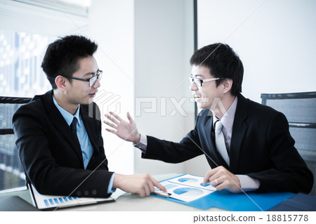 Two Businessmen Having Informal Meeting In Modern Office Two Businessmen Having Informal Meeting In Modern Office 18815778