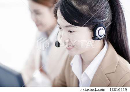 Asian women call center with phone headset Asian women call center with phone headset 18816339