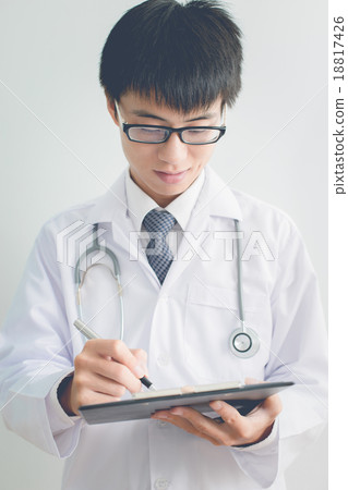 Close-up Of Male Doctor Filling The Medical Form 18817426