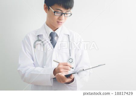 Close-up Of Male Doctor Filling The Medical Form 18817429