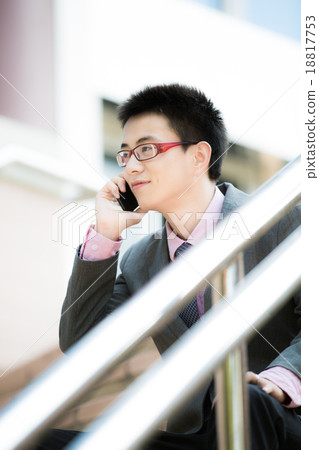 young businessman using cellphone closeup 18817753