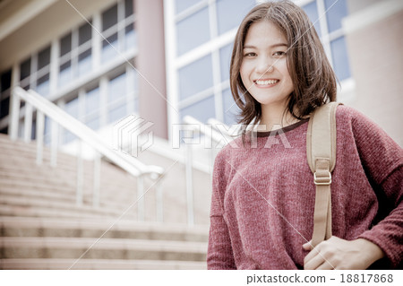 attractive female college student sitting on stairs attractive female college student sitting on stairs 18817868