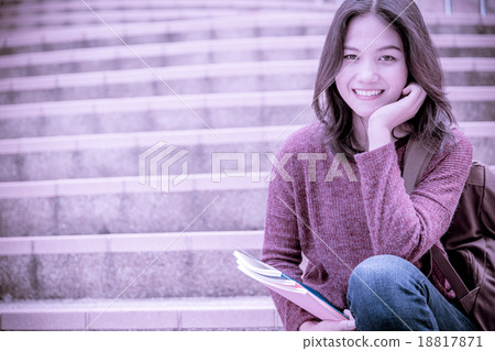 attractive female college student sitting on stairs attractive female college student sitting on stairs 18817871