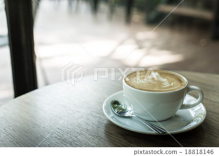 Hot latte art coffee cup on wooden table, vintage and retro styl Hot latte art coffee cup on wooden table, vintage and retro styl 18818146