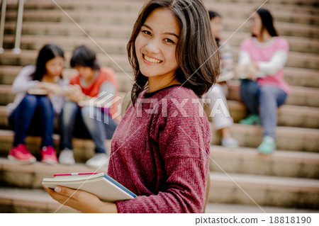 group of happy teen high school students outdoors 18818190