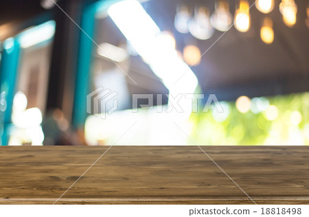 Selected focus empty brown wooden table and Coffee shop blur bac Selected focus empty brown wooden table and Coffee shop blur bac 18818498