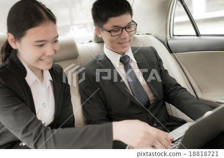 Young business team working together in the car 18818721