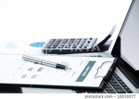 Businessman analyzing investment charts on laptop 18818877