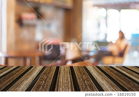 Selected focus empty brown wooden table and Coffee shop blur bac 18819150