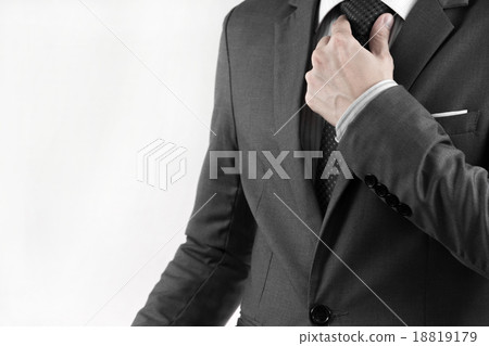 Business man adjusting his necktie 18819179