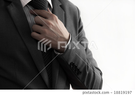 Business man adjusting his necktie 18819197