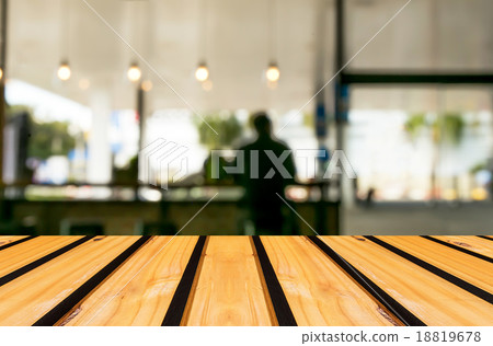 Selected focus empty brown wooden table and Coffee shop blur bac Selected focus empty brown wooden table and Coffee shop blur bac 18819678