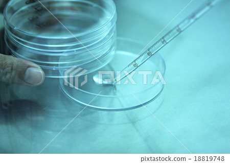 Blue light of Pipette adding fluid water to test tubes. 18819748