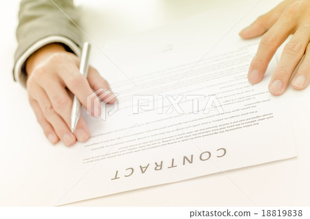 Business man signing a contract Business man signing a contract 18819838