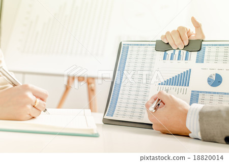Business people discussing the charts and graphs showing the res 18820014