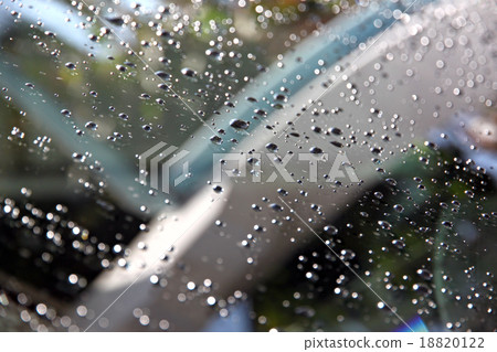 Water Drops on front of Car windshield. 18820122