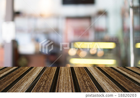 Selected focus empty brown wooden table and Coffee shop blur bac 18820203