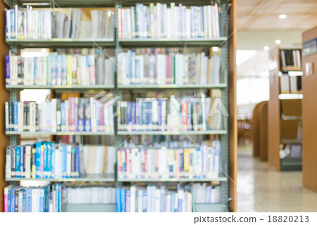 books on bookshelf in library, abstract blur defocused backgroun 18820213