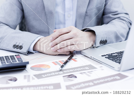 Businessman analyzing investment charts with laptop. Accounting 18820232