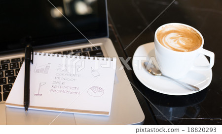 Workplace, laptop and notepad with hand drawn business plan sele 18820293
