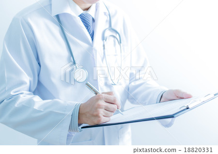 Close-up of male hands filling in medical form 18820331