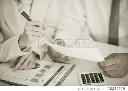 Business people discussing the charts and graphs showing the res 18820619
