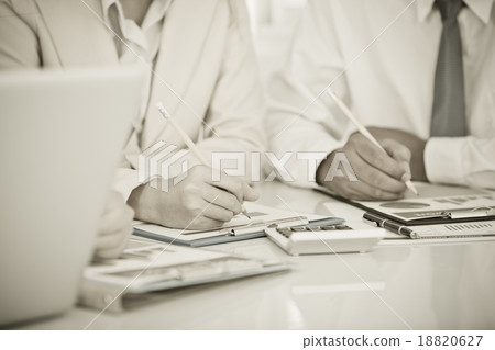 Business people discussing the charts and graphs showing the res 18820627