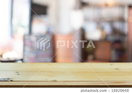 Selected focus empty brown wooden table and Coffee shop blur bac 18820648