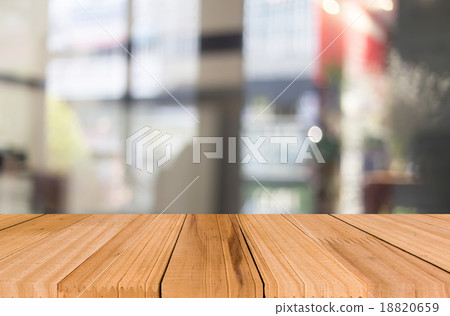 Selected focus empty brown wooden table and Coffee shop blur bac 18820659