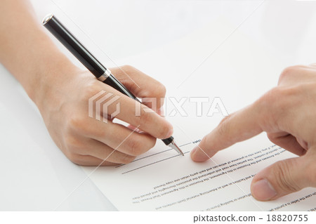 Female hand signing contract. Female hand signing contract. 18820755