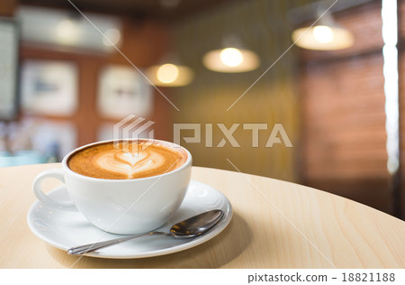 Hot art Latte Coffee in a cup on wooden table and Coffee shop bl 18821188