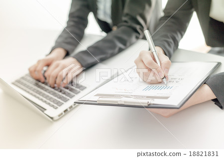 Business people discussing the charts and graphs showing the res 18821831