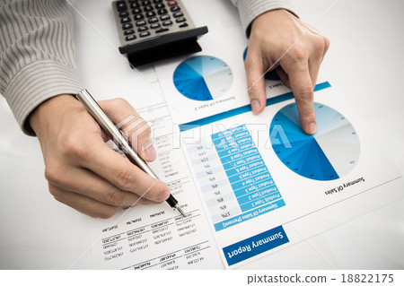 man hand with pen and business report 18822175